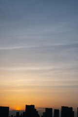 Stunning cityscape with blue and orange colours during sunset sky with veil clouds in Tokyo city in Japan with space for text.