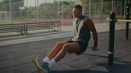 Athletic man performing tricep dips in an urban park setting. This outdoor workout scene captures fitness and determination, highlighting the benefits of outdoor physical activities. - Powered by Adobe