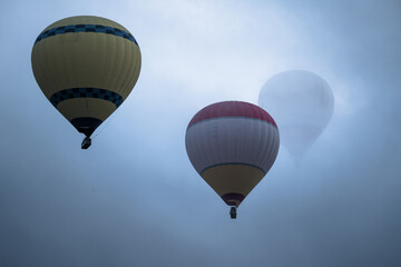 Hot Air Balloons Flying Over Cloudy Cappadocia, Turkey
