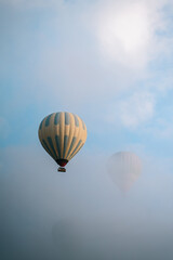 Hot Air Balloons Flying Over Cloudy Cappadocia, Turkey