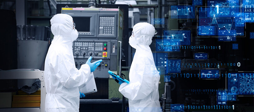 Group of people working in protective clothing in factory and digital technology concept