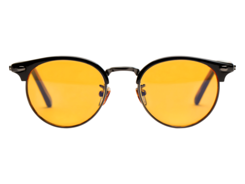 Close up of eyeglasses with bright yellow tinted lenses.