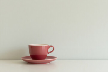 Fototapeta premium minimalistic table setting featuring single colorful cup on ultrabright clean background
