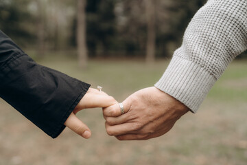 Man and woman holding each other hands