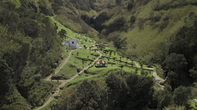 Drone flies south through an amazing picnic area, Parque de Merendas do Fojo, toward Salto da Farinha waterfall in Sao Miguel, Azores, Portugal