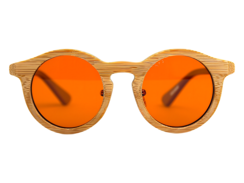 Close up of wooden sunglasses with orange tinted lenses