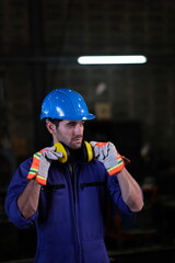 Obraz premium Portrait of foreman, engineer or architect with safety helmet holding laptop and blueprints for inspection details on factory industry material.
