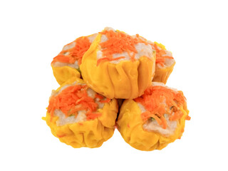 Yellow dimsum or Siomay chicken and shrimp variance with carrot above, isolated in white background
