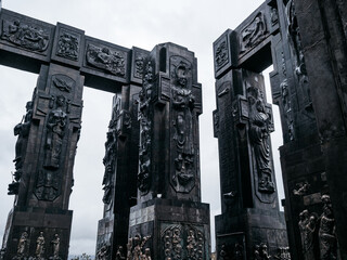 Chronicles of Georgia, monument history, design detail on black sculpture pillars, famous tourist...