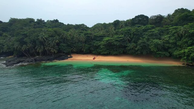 Flying sideways and low along the sea with Margarida beach in the background as well as the wonderful coast of Principe Island, S&atilde;o Tom&eacute;,Africa
