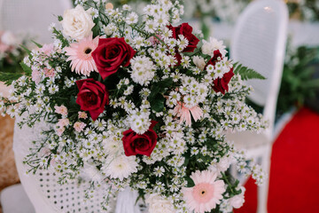 Floral bouquet of red roses and white baby's breath, elegant floral design
