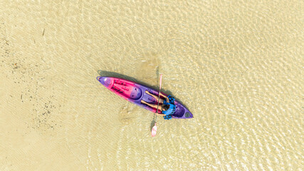 Aerial view of a kayak in the blue sea .man kayaking he does water sports activities