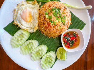 Thai food fried rice on a plate on the white background