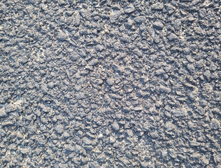 This is a close-up of an asphalt road.