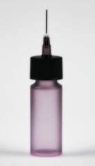A purple frosted glass bottle with a black cap and a needle