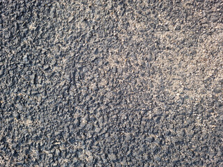 This is a close-up of an asphalt road.