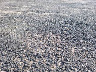 This is a close-up of an asphalt road.