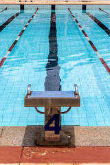 Starting platforms with number 4 for swimming races and competitions in Brazil. Swimming pool...