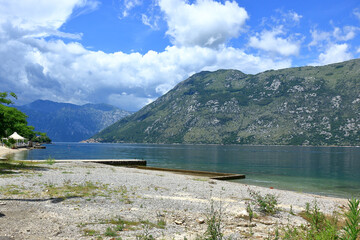 Mountains and a shingle beach at the Bay of Kator