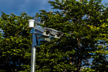 Urban surveillance and traffic monitoring cameras on metal poles in Brazil. Devices help improve public safety, vehicle control, and city management through smart technology.