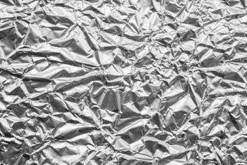 Shiny metal silver gray foil leaf crumpled texture background