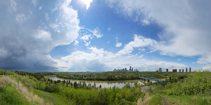 Panoramic image of Edmonton, Alberta, Canada with surrounding storm clouds.