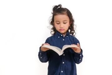 A little Asian girl reading a story book, on a white background