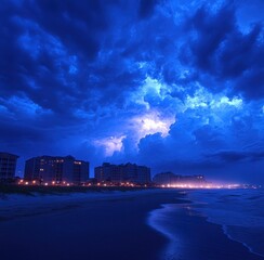 Dramatic, illuminated storm clouds over a coastal city skyline at night with reflections on wet sand and calm ocean waves creating a moody atmosphere