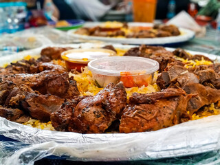 Nasi kebuli or Nasi Mandhi or Biryani rice. It consists of Basmati rice cooked in goat meat broth, goat milk, and clarified butter. Completed with chicken breast and thighs.Savory taste.
