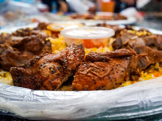 Nasi kebuli or Nasi Mandhi or Biryani rice. It consists of Basmati rice cooked in goat meat broth, goat milk, and clarified butter. Completed with chicken breast and thighs.Savory taste.
