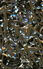 Audio magnetic cassette tape tangled and twisted in an abstract background detail pattern