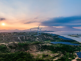 Solar photovoltaic windmill wind energy at sunset