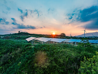 Solar photovoltaic windmill wind energy at sunset
