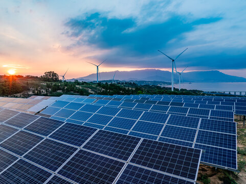 Solar photovoltaic windmill wind energy at sunset