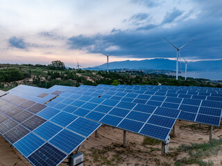Solar photovoltaic windmill wind energy at sunset