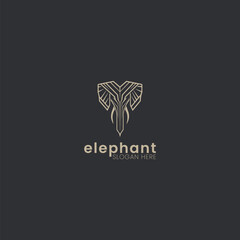 Simple modern elephant logo. Elephant silhouette. Elephant head logo. Geometric logo on black background. Golden logo. 