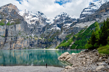 The Oeschinensee with a man in front
