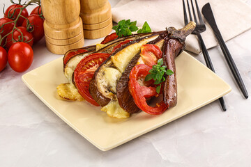 Baked tomato with mozzarella and tomato