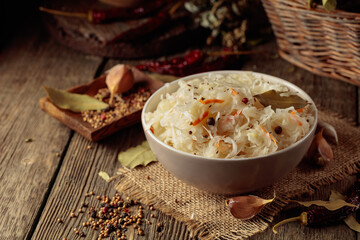 Traditional German sauerkraut on a old rustic wooden table.