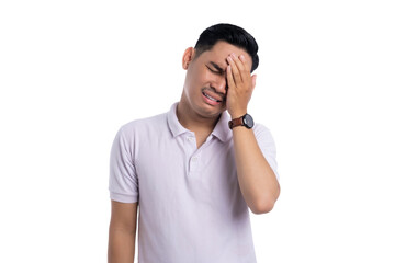 Frustrated young man touching forehead with pained expression, feeling regret and stress isolated on transparent background