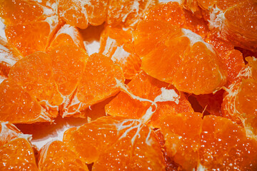 Fresh Orange Slices on Orange Background – Citrus Fruit Texture and Pattern