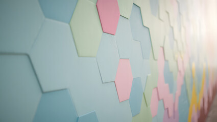 A pastel colored hexagon pattern wall with blue pink and green shapes creating an abstract design