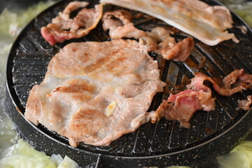 pork barbecue on frying pan, Thai style cuisine
