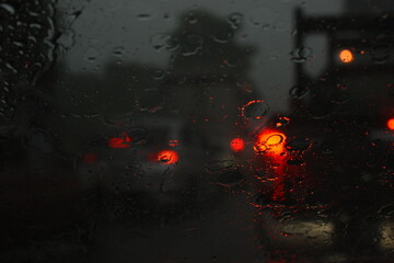 car on highway road in the night with heavy rainny season, blurred image