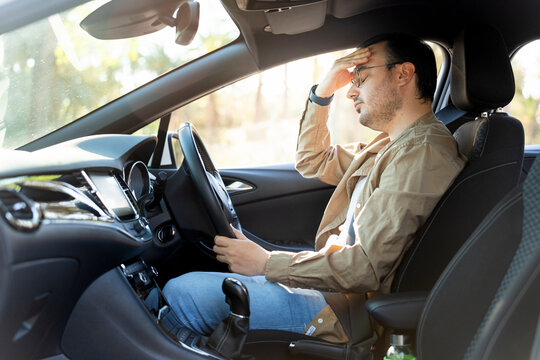 Stressed driver experiencing car trouble on road trip