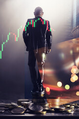 A miniature man standing in front of a stack of coins. double exposure of businessman with coins...
