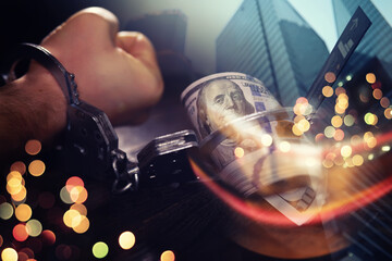  Double exposure city and hands of a man with handcuffs on a background of us dollars. Fraud, cyber...