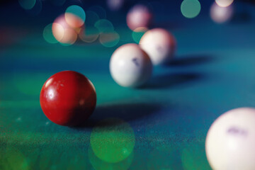 Billiard balls and cue on pool table. Russian billiards. Close-up of items for the game. Background...