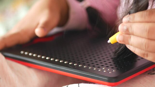 Child Engaging with Magnetic Dot Drawing Board for Creative Play