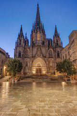 The imposing Barcelona Cathedral at dawn with no people